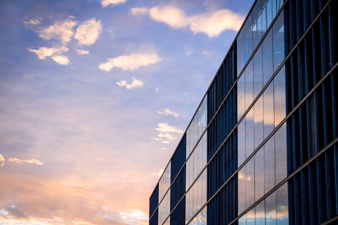 Glass office facade seen from below